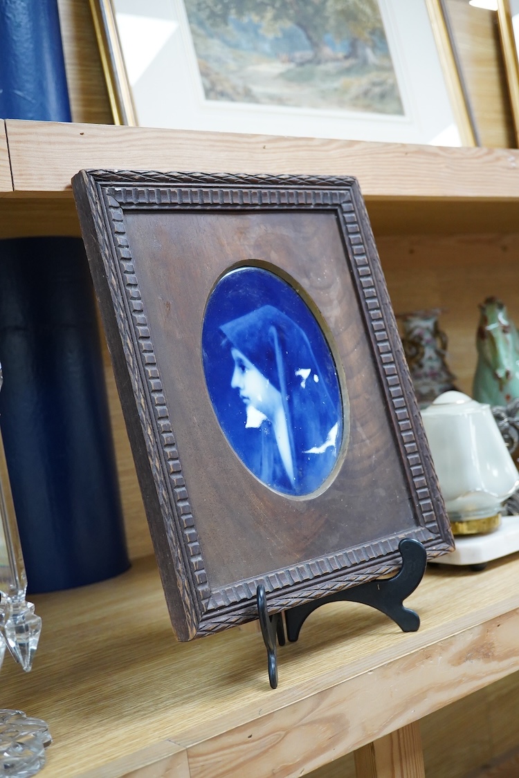 A Limoges plaque depicting a portrait of Saint Fabiola after Jean-Jacques Henner, framed, 29cm high
